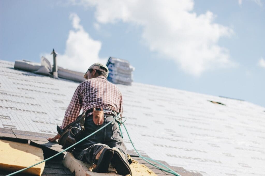 Aztec homes worker installing a roof replacement