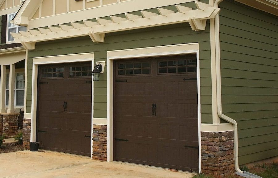 A home with new green siding after learning how the siding process works
