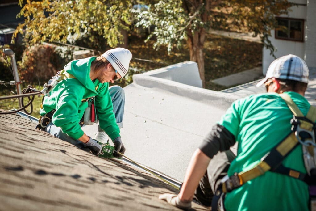 Professional roofers doing a roof inspection