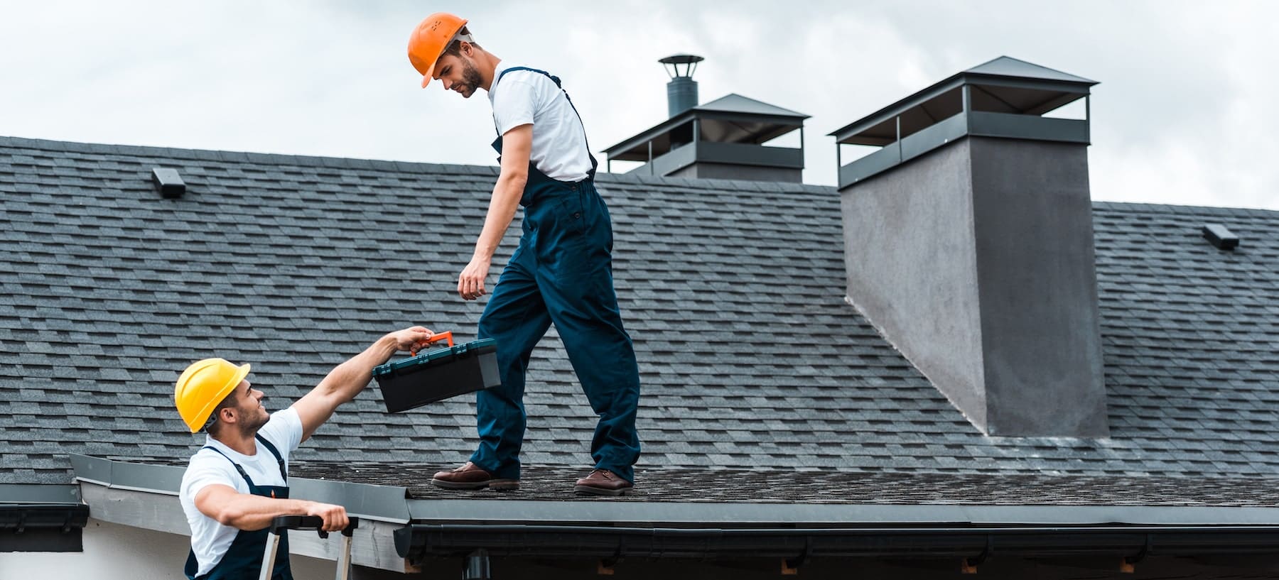 Workers performing roof maintenance.