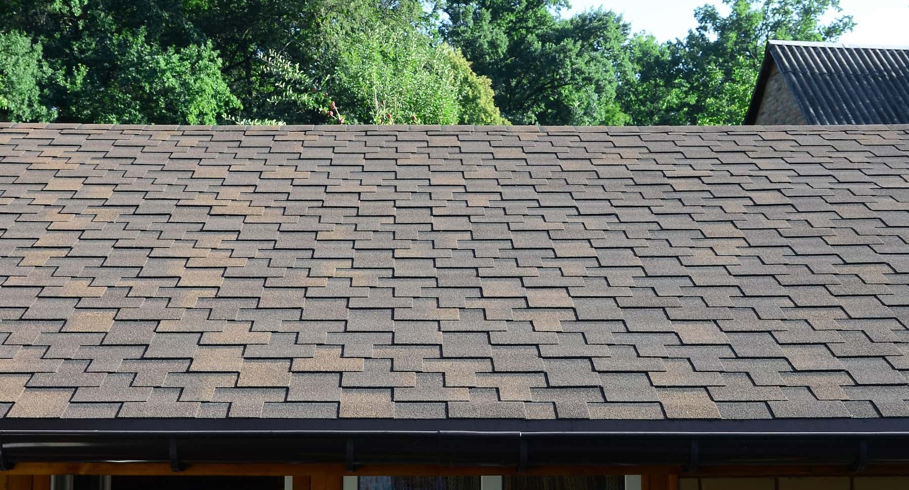 Enhance your home's performance with asphalt roofing services from Aztec.