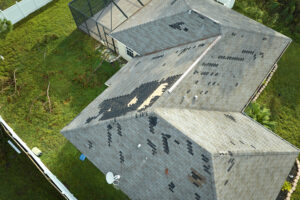 Identify the key signs of wind damage for your roof and shingles