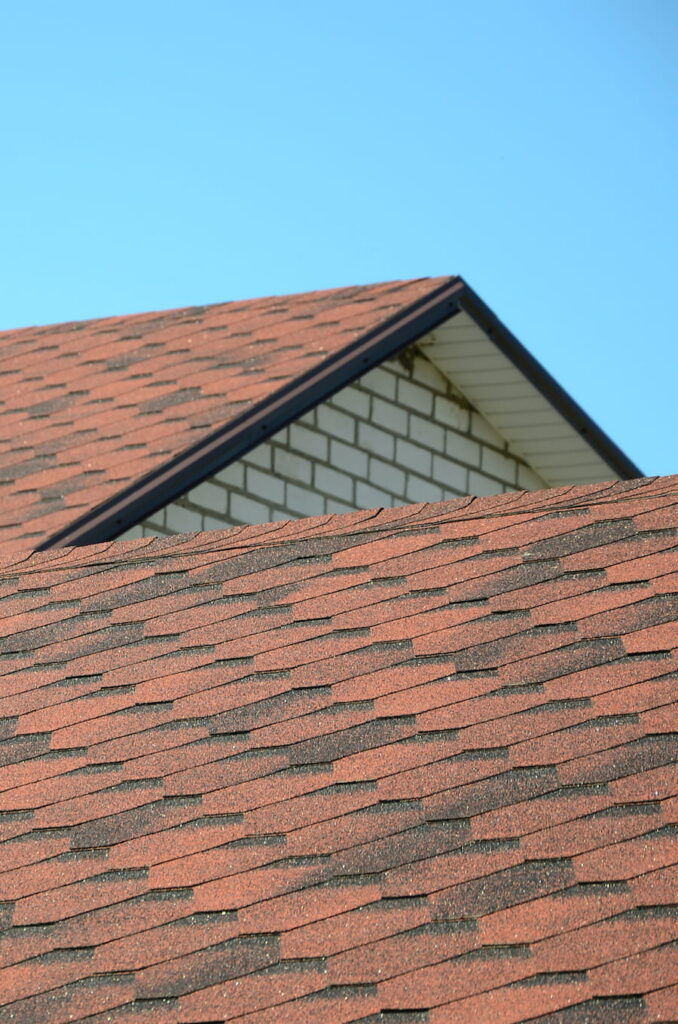 Exterior view of rooftop shingles on suburban home