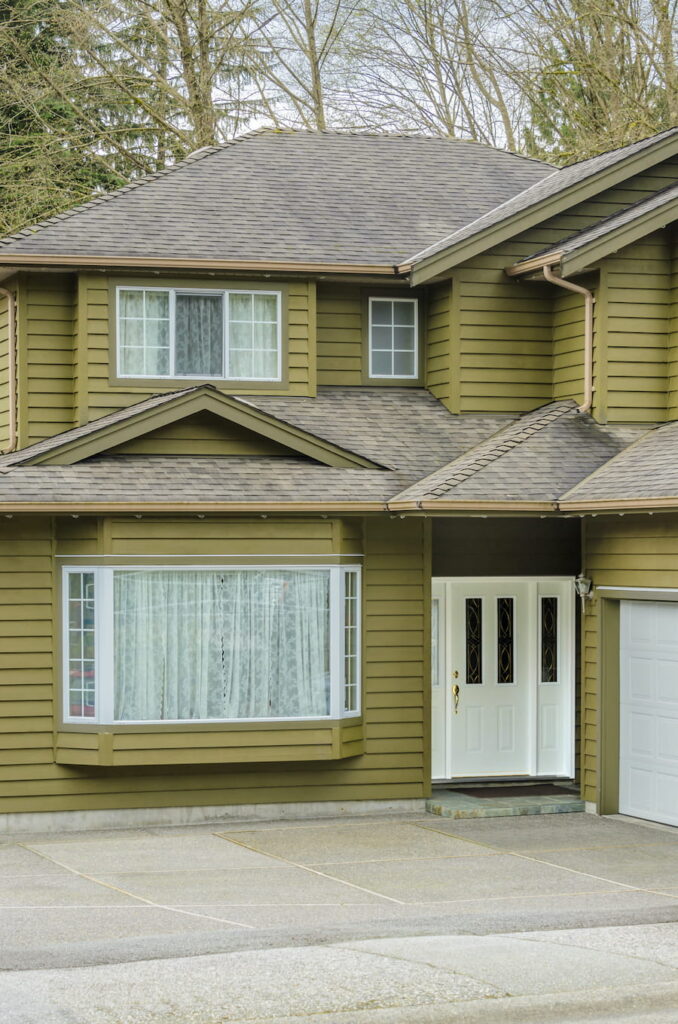 Suburban Home Facade with Landscaping in Daytime
