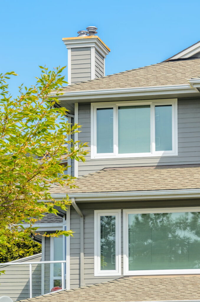 House Exterior With Green Tree and Blue Sky