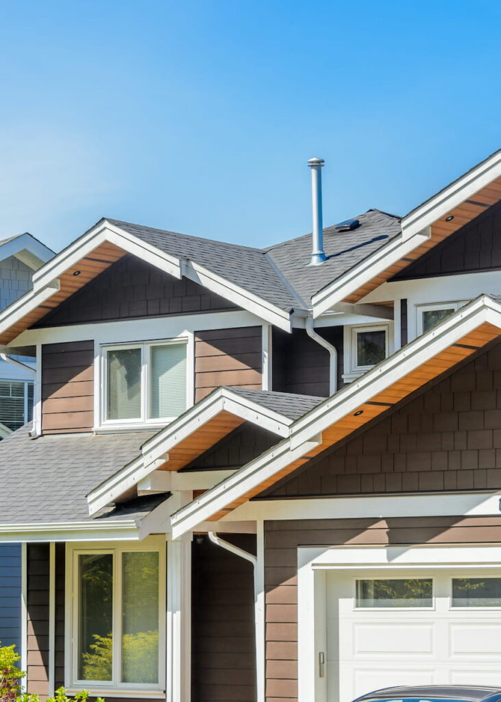 Brown House with Clear Blue Sky in Neighborhood